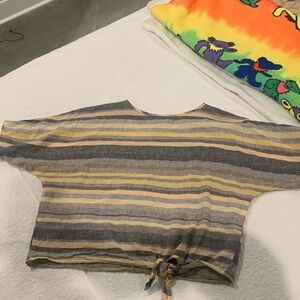 Oversized linen shirt.  Short sleeve with tie at the bottom.  Size xs